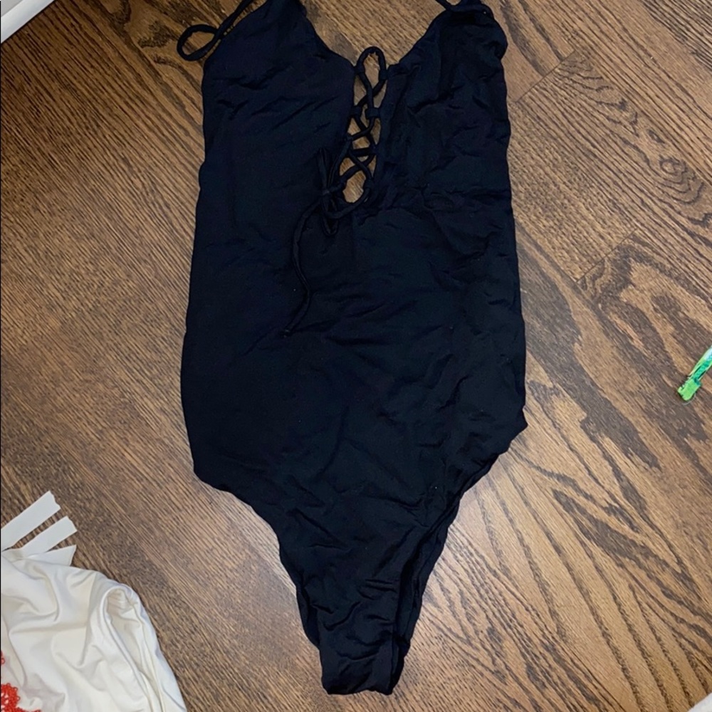String crossover black one piece